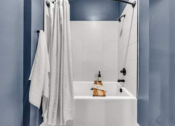 A white bathroom sink with a towel hanging on the wall at Luxe 360 on Centerpointe Apartments, Midlothian, 23114