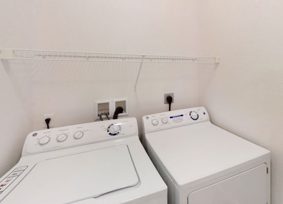 A washer and dryer in a laundry room at Lynbrook Apartment Homes and Townhomes, Elkhorn
