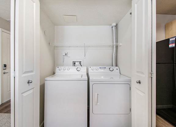 A laundry area with a washer and dryer at Lynbrook Apartments and Townhomes, Elkhorn, NE, 68022