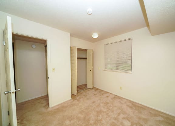 Bedroom with Large Closet at Madeira Apartments in Kalamazoo, MI