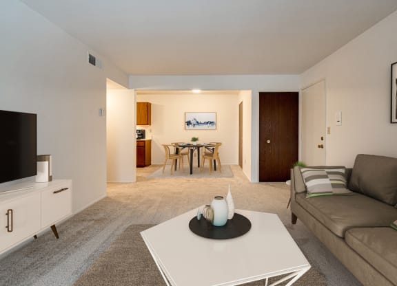 Magnolia Layout Living Room with Dining View at Fox Pointe Apartments, East Moline, IL 61244
