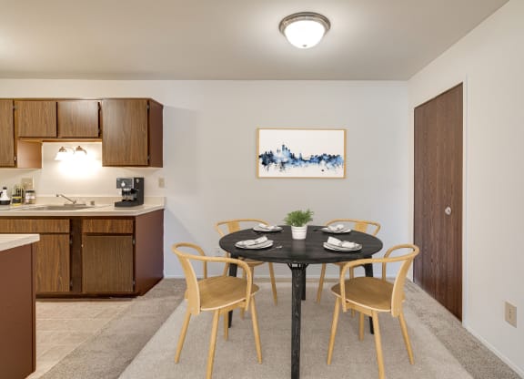 Magnolia Layout Dining Space Next to Kitchen at Fox Pointe Apartments, East Moline 61244
