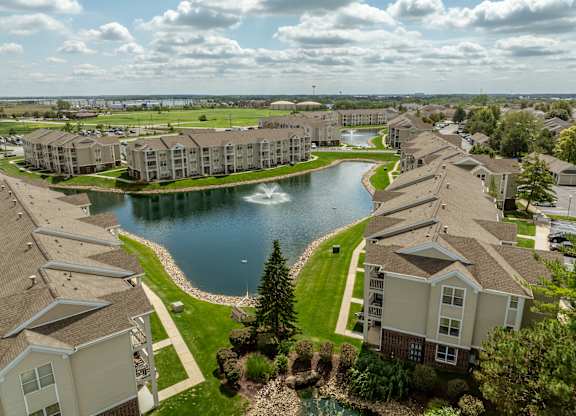 A large lake is surrounded by apartment buildings at Mallard Bay Apartments, Crown Point, Indiana