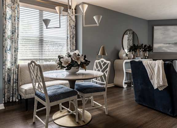 A dining room with a table set for four at Mallard Bay Apartments, Crown Point, Indiana