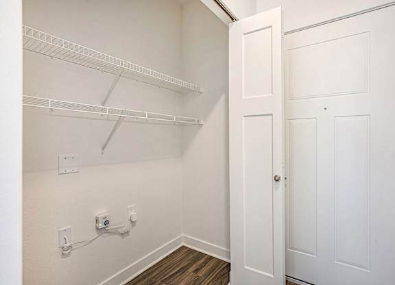 An entry closet with shelves at Meadowbrooke Apartment Homes in Kentwood, MI 49512