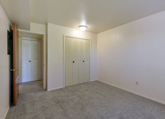 Bedroom with Large Closet at Old Monterey Apartments, Missouri, 65807 at Old Monterey Apartments, Missouri, 65807
