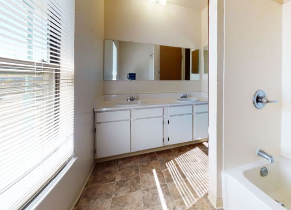 Renovated Bathroom with Double Sinks at Mount Royal Townhomes, Kalamazoo