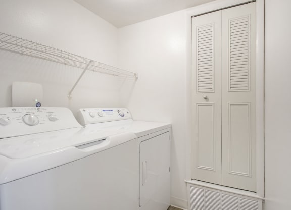 a laundry room with a washer and dryer at North Pointe Apartments in Elkhart, IN