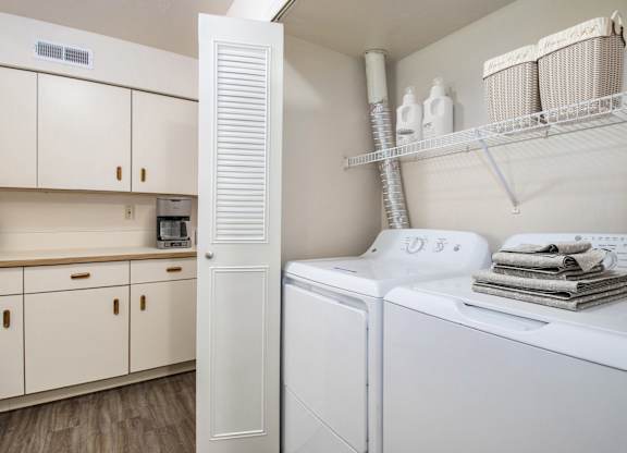 A laundry area with a washer and dryer at North Pointe Apartments in Elkhart, IN