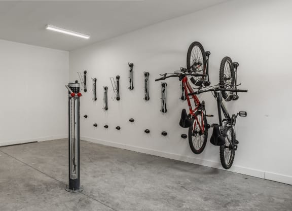 a wall with bikes hanging on it and other bike parts on the wall at Nuvo Flats, Merrillville, IN, Indiana
