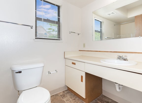 End Bath with Window at Oak Shores Apartments in Oak Creek, WI