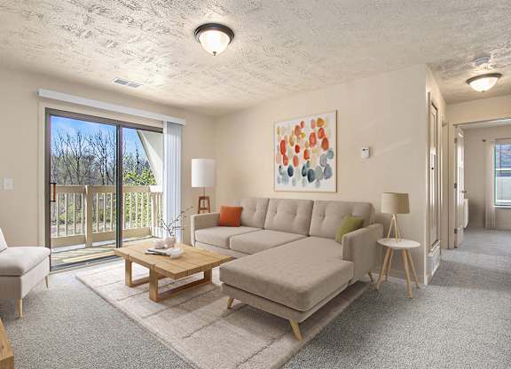 living room with a sliding glass door to a balcony at Old Farm Apartments, Elkhart, Indiana