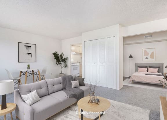 a living room with a couch and a bed at Old Farm Apartments, Elkhart, 46517
