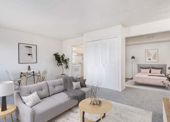 a living room with a couch and a bed at Old Farm Apartments, Elkhart, 46517
