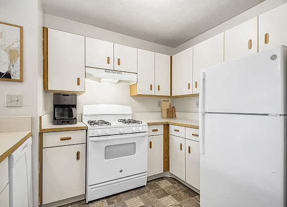 A kitchen with white appliances at Orchard Lakes Apartments, Toledo, 43615