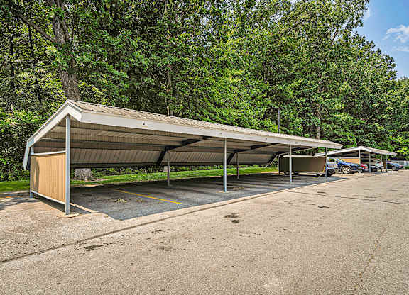 A parking lot with reserved carports at Orchard Lakes Apartments, Toledo, 43615