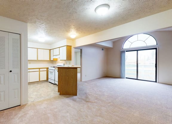 large living room and kitchen with large windows at Pine Knoll Apartments, Battle Creek, 49014
