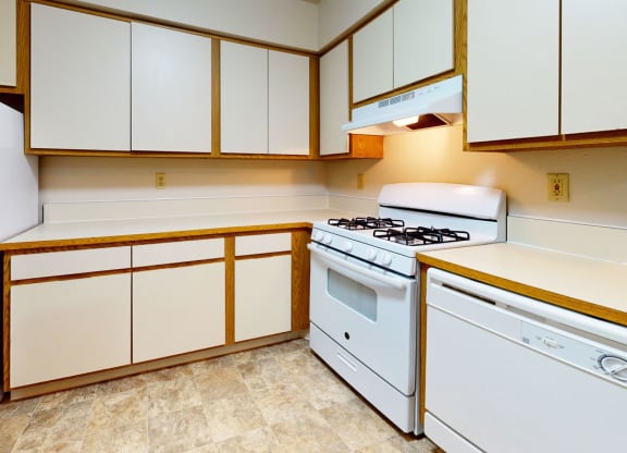 a kitchen with white appliances at Pine Knoll Apartments, Battle Creek, 49014