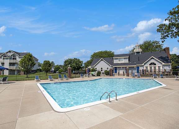 A large swimming pool in a sunny outdoor setting at Pine Knoll Apartments, Michigan, 49014