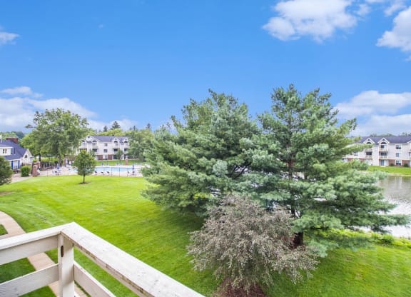 pond and pool view from private balcony at Pine Knoll Apartments, Battle Creek