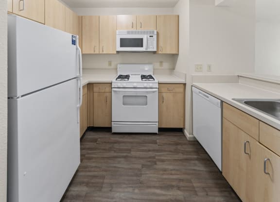 Two Bedroom Kitchen with Microwave and Gas Range at Hunters Pond Apartment Homes, Champaign, IL