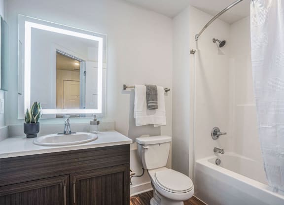 Master Bath with Hard-Surface Flooring at Meadowbrooke Apartment Homes in Grand Rapids, MI 49512