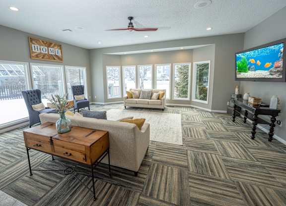 A living room with a television and a couch at Portsmouth Apartments, 48377