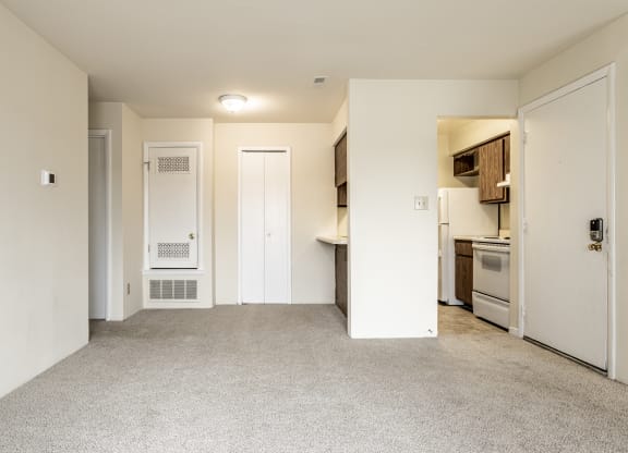 a renovated living room and kitchen in an apartment at Scarborough Lake Apartments, Indianapolis, 46254
