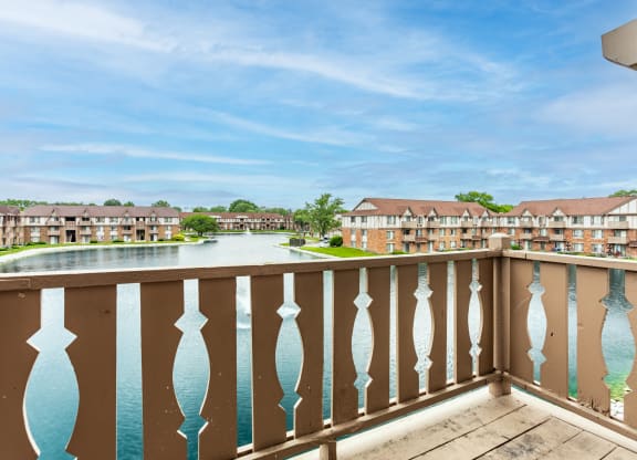 the view from the balcony of an apartment building overlooking a lake at Scarborough Lake Apartments, Indianapolis, Indiana, 46254