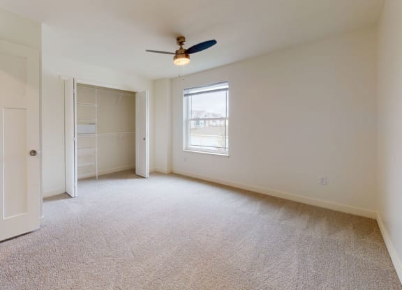 Spacious Bedroom with Large Closet at The Reserve at Destination Pointe in Grimes, IA with