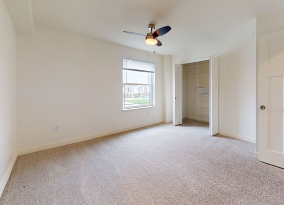 Bedroom with Large Walk-In Closet at The Reserve at Destination Pointe in Grimes, IA with