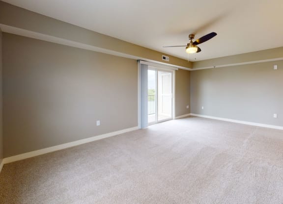 Enlarged Living Room at The Reserve at Destination Pointe in Grimes, IA with