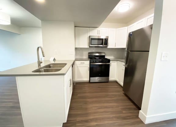 Modern Kitchen with Breakfast Bar at Green Ridge Apartments in Grand Rapids, MI