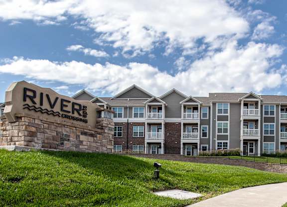 A building with a sign that says  at River Crossing Apartments, St. Charles, Missouri
