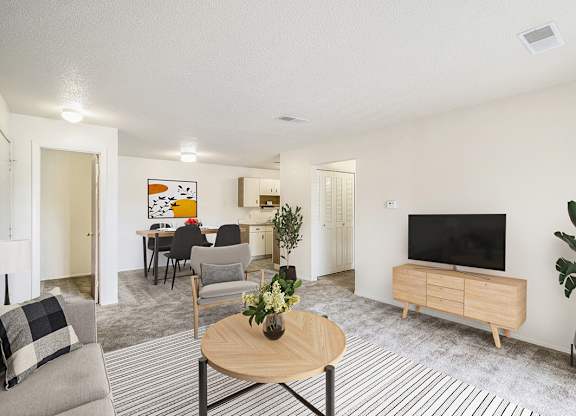 a living room and dining room at Seville Apartments, Kalamazoo, MI, 49009