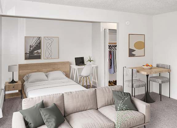 a living room with a sleeping area at Seville Apartments, Kalamazoo, 49009