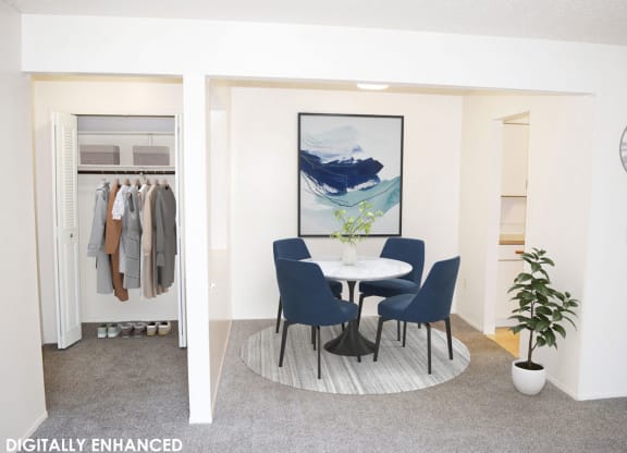 Dining room with an entry door to a closet at Seville Apartments in Kalamazoo, MI 49009