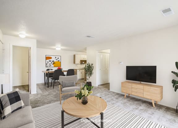 a living room and dining room at Seville Apartments, Kalamazoo, MI, 49009