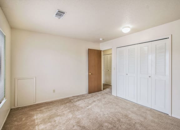 Bedroom with large closet at Seville Apartments, Kalamazoo, Michigan