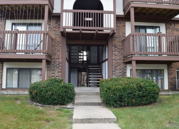 the walkway up to the entrance of a brick apartment building at Seville Apartments, Michigan