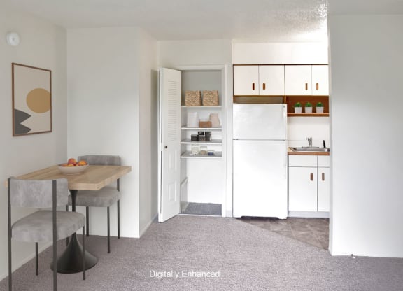 a kitchen and dining room with a closet at Seville Apartments, Kalamazoo, 49009