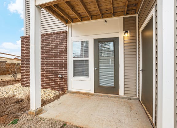 Private patio with a door to enclosed storage  at Signature Pointe Apartment Homes, Athens, 35611