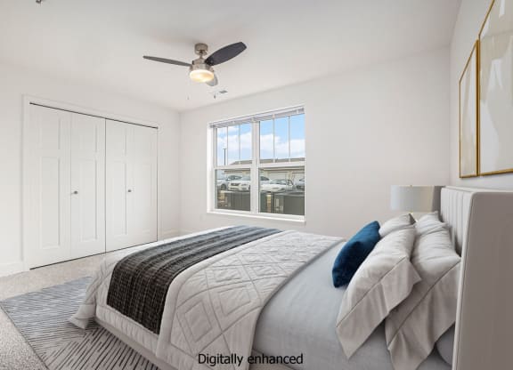 Bedroom with ceiling fan at Signature Pointe Apartment Homes in Athens, AL