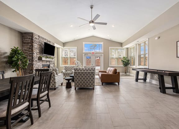 Clubhouse dining table with chairs  at Signature Pointe Apartment Homes, Alabama, 35611