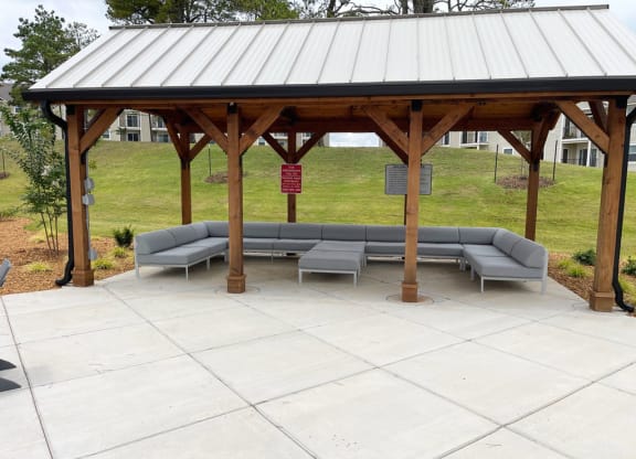 oversized covered seating area near the pool at Signature Pointe Apartment Homes in Athens, AL
