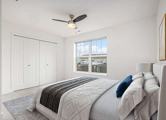 Bedroom with ceiling fan at Signature Pointe Apartment Homes in Athens, AL