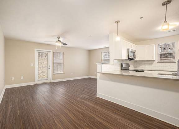 An entryway into the kitchen and enlarged living room at Signature Pointe Apartment Homes, Athens, 35611