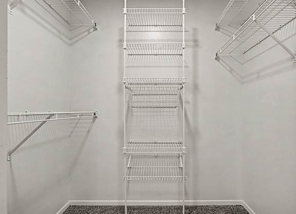 Empty shelves in a white room.