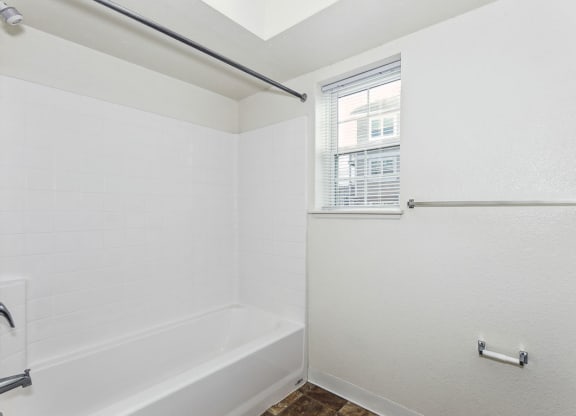 Large Bathroom  with Tub/Shower Combination at Stoney Pointe Apartment Homes in Wichita, KS