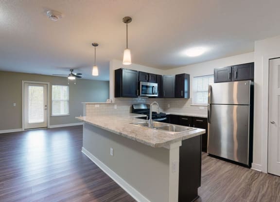 End style kitchen with stainless steel appliances at Strathmore Apartment Homes, West Des Moines, 50266